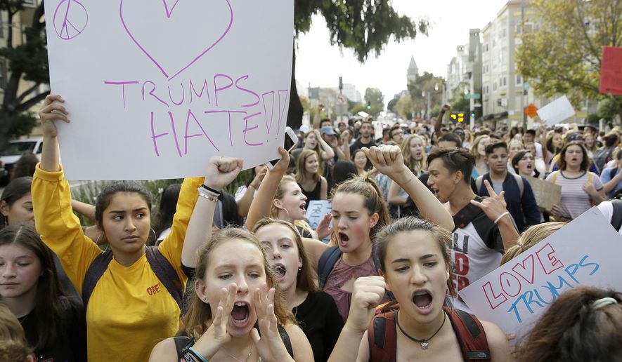 In this Thursday, Nov. 10, 2016, file photo, high school students protest in opposition of Donald Trump's presidential election victory in San Francisco. Thousands of high school students have taken to the streets in cities across the country since Donald Trump's election to protest his proposed crackdown on illegal immigration and his vulgar comments about women. (AP Photo/Eric Risberg, File)