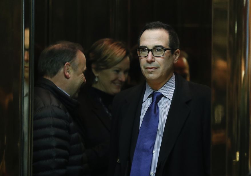 Steven Mnuchin, national finance chairman of President-elect Donald Trump's campaign, boards an elevator as he arrives at Trump Tower, Monday, Nov. 21, 2016 in New York, to meet with President-elect Donald Trump. (AP Photo/Carolyn Kaster)