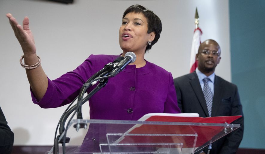 Washington Mayor Muriel Bowser, left, speaks at a news conference at Easter High School in Washington, Tuesday, Nov. 22, 2016, to announce Antwan Wilson, right, the new Washington Schools Chancellor. (AP Photo/Andrew Harnik) ** FILE **