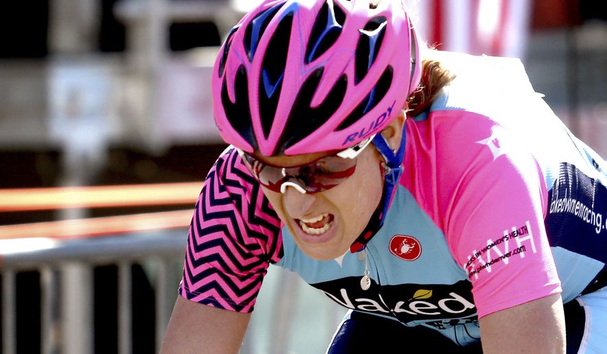 Jillian Bearden, the women&#39;s division top finisher, crosses the finish line in the 34th El Tour de Tucson cycling race, Saturday, Nov. 19, 2016, Tucson, Ariz. (Kelly Presnell/Arizona Daily Star via AP)