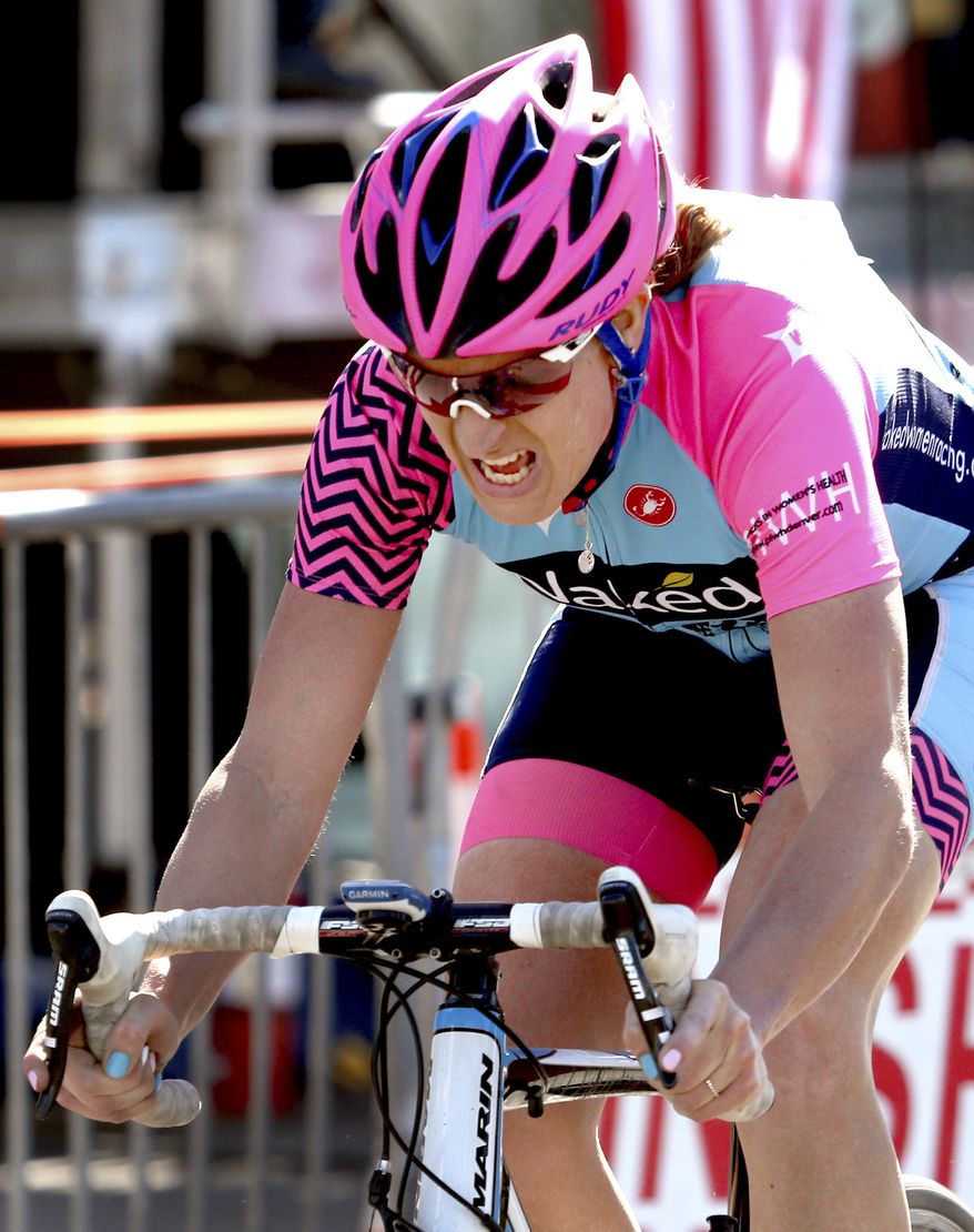Jillian Bearden, the women's division top finisher, crosses the finish line in the 34th El Tour de Tucson cycling race, Saturday, Nov. 19, 2016, Tucson, Ariz. (Kelly Presnell/Arizona Daily Star via AP)