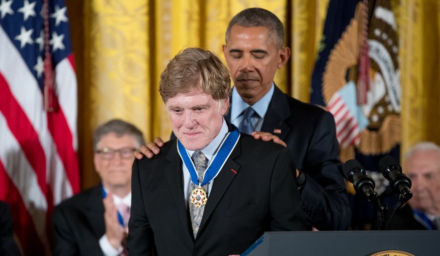 President Barack Obama presents the Presidential Medal of Freedom to actor Robert Redford during a ceremony in the East Room of the White House, Tuesday, Nov. 22, 2016, in Washington. (AP Photo/Andrew Harnik)