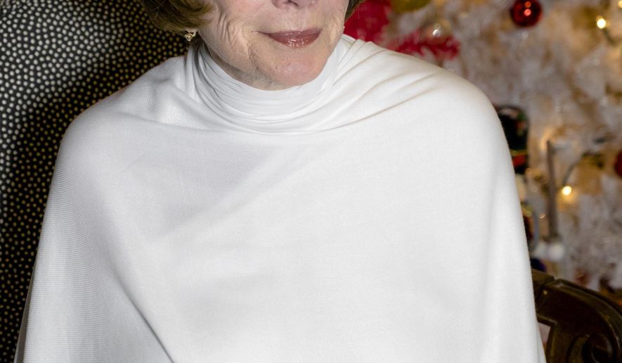 In this image released by the Hallmark Channel, actress Shirley MacLaine plays an angel in "A Heavenly Christmas," a Hallmark Hall of Fame TV movie airing 8 p.m. EST Saturday on the Hallmark Channel. (Chris Helcermanas-Benge/Crown Media United States LLC via AP)