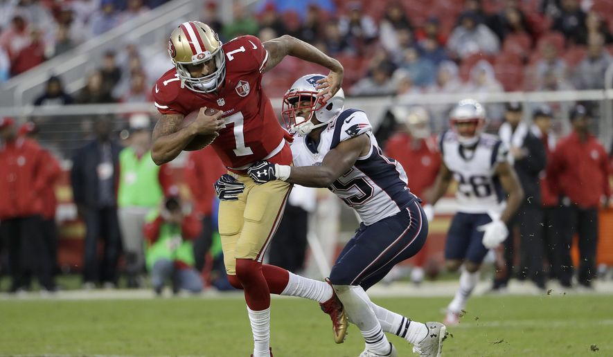 San Francisco 49ers quarterback Colin Kaepernick (7) tries to run from New England Patriots cornerback Eric Rowe during the second half of an NFL football game in Santa Clara, Calif., Sunday, Nov. 20, 2016. (AP Photo/Marcio Jose Sanchez)