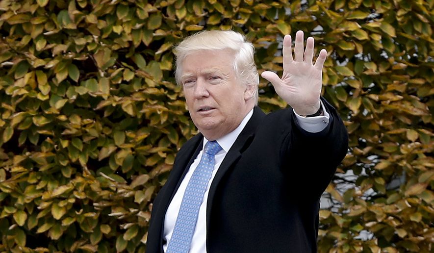 President-elect Donald Trump waves as he arrives at the Trump National Golf Club Bedminster clubhouse, Sunday, Nov. 20, 2016, in Bedminster, N.J.. (AP Photo/Carolyn Kaster) **FILE**