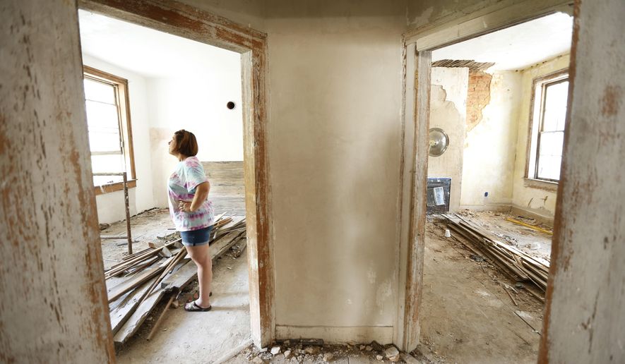 In this Nov. 1, 2016 photo, Genevieve Busby stands inside the Chalmers Institute, in Holy Springs, Miss. Busby and her family have gotten involved in the rehabilitation of the the institute that was built in 1837. (Thomas Wells/The Northeast Mississippi Daily Journal via AP)