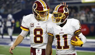 Washington Redskins quarterback Kirk Cousins (8) and wide receiver DeSean Jackson (11) celebrate a touchdown scored by Jackson on a pass from Cousins in the second half of an NFL football game against the Dallas Cowboys on Thursday, Nov. 24, 2016, in Arlington, Texas. (AP Photo/Michael Ainsworth)