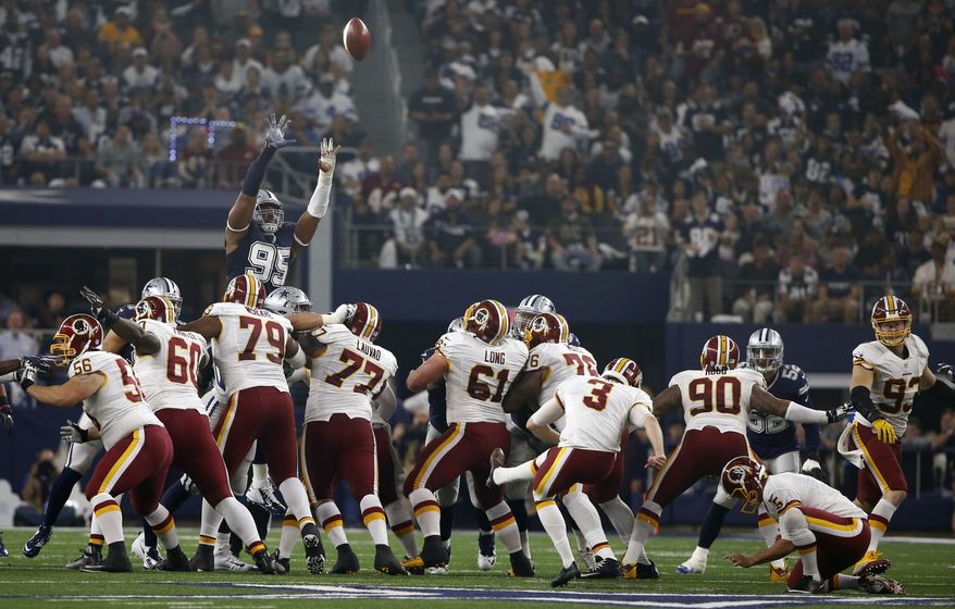 Dallas Cowboys defensive tackle David Irving (95) leaps as Washington Redskins kicker Dustin Hopkins (3) follows through on a failed field goal-attempt in the first half of an NFL football game, Thursday, Nov. 24, 2016, in Arlington, Texas. (AP Photo/Ron Jenkins)