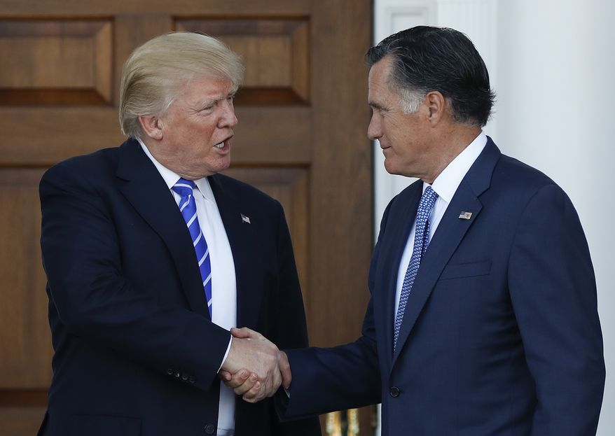 President-elect Donald Trump and Mitt Romney shake hands at the entrance of Trump National Golf Club Bedminster clubhouse in Bedminster, N.J., Saturday, Nov. 19, 2016, after meeting. (AP Photo/Carolyn Kaster) ** FILE **
