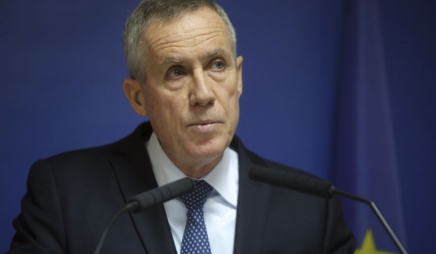 Paris prosecutor Francois Molins gives a press conference, in Paris, Friday, Nov. 25, 2016. Five men arrested this week in two French cities were planning a terror attack in France as early as next week and were receiving their orders from an Islamic State group member based in Iraq or Syria, Paris prosecutor Francois Molins said Friday. (AP Photo/Thibault Camus)