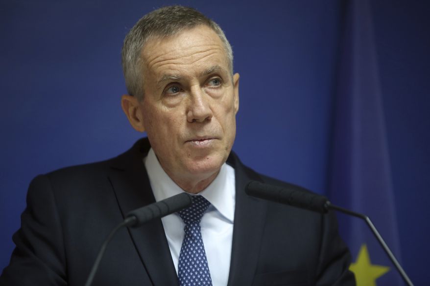 Paris prosecutor Francois Molins gives a press conference, in Paris, Friday, Nov. 25, 2016. Five men arrested this week in two French cities were planning a terror attack in France as early as next week and were receiving their orders from an Islamic State group member based in Iraq or Syria, Paris prosecutor Francois Molins said Friday. (AP Photo/Thibault Camus)