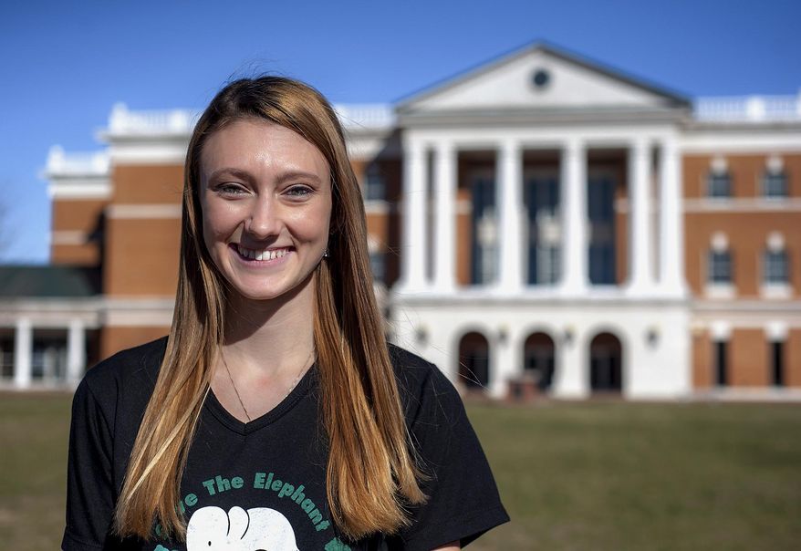 ADVANCE FOR WEEKEND EDITIONS - In this Monday, Nov. 21, 2016, photo, Bridgewater College senior Stephanie Rubino poses for a portrait in front of the school's McKinney Hall in Bridgewater, Va. This past summer Rubino spent two weeks in Thailand working with rescued elephants at an elephant sanctuary. (Austin Bachand/Daily News-Record via AP)
