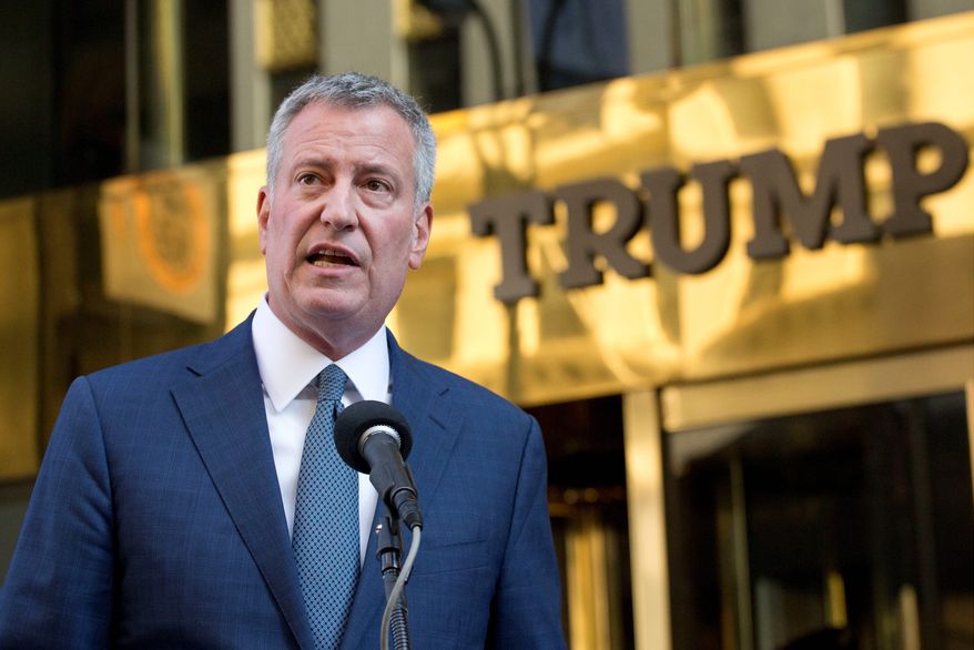 New York Mayor Bill de Blasio suggests that he will send the bill to the federal government to secure properties of President-elect Donald Trump. (Associated Press)