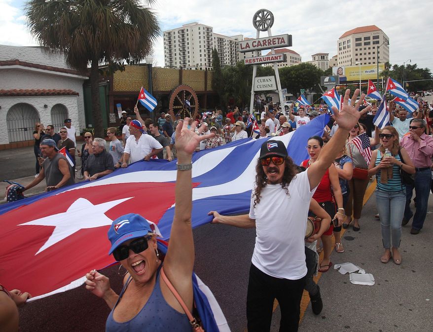Cuban residents of Miami’s Little Havana celebrate the news that Fidel Castro, the dictator who stepped down from power in 2008, had died at the age of 90. (Associated Press)