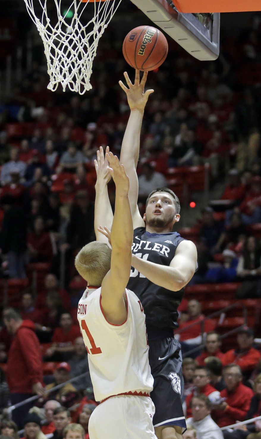 Butler center Nate Fowler, rear, shoots as Utah forward Tyler Rawson, left, defends in the first half during an NCAA college basketball game, Monday, Nov. 28, 2016, in Salt Lake City. (AP Photo/Rick Bowmer)