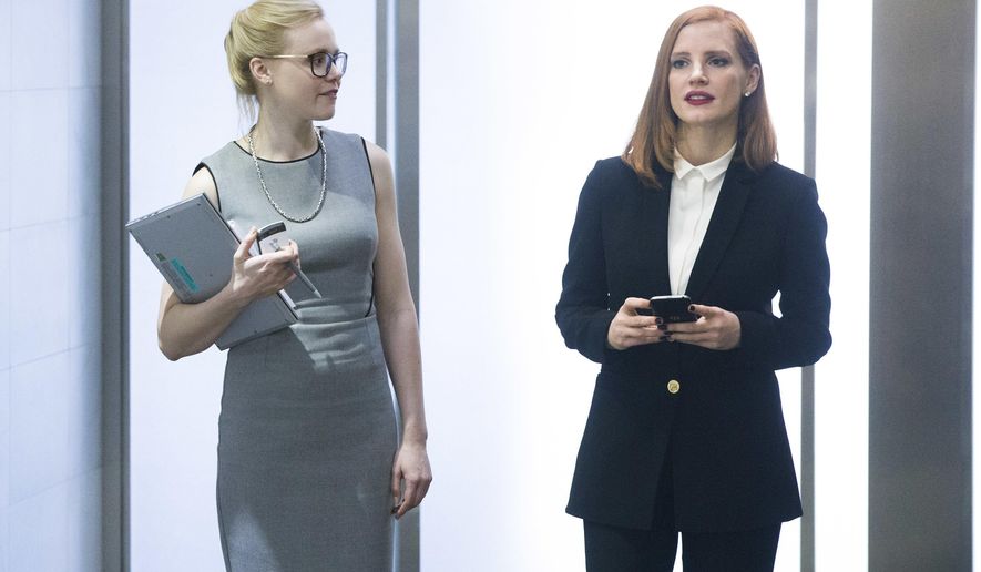 This image released by Europa shows Alison Pill, left, and Jessica Chastain in a scene from, "Miss Sloane." (Kerry Hayes/Europa via AP)