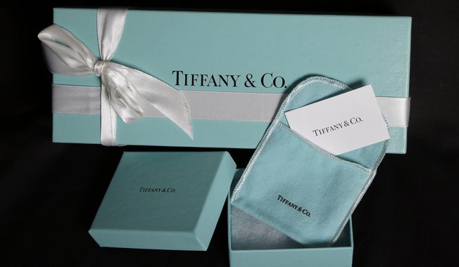 FILE - This Nov. 27, 2012, file photo, shows Tiffany &amp;amp; Co. gift boxes displayed in Boston. Tiffany &amp;amp; Co. reports financial earnings Tuesday, Nov. 29, 2016. (AP Photo/Elise Amendola, File)