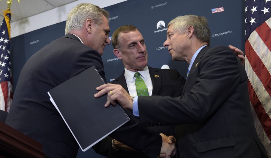 House Majority Leader Kevin McCarthy of Calif., left, shakes hands with Rep. Tim Murphy, R-Pa., center, and Rep. Fred Upton, R-Mich, right, during a news conference on Capitol Hill in Washington, Wednesday, Nov. 30, 2016. Upton and Murphy talked about the 21st Century Cures Act which would provide $6.3 billion over the next decade, including $1 billion for state grants for programs for preventing and treating the abuse of opioids and other addictive drugs. It would also expand government mental health programs. (AP Photo/Susan Walsh)