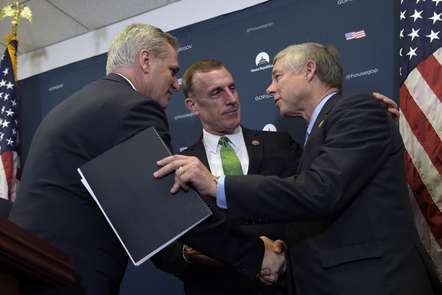 House Majority Leader Kevin McCarthy of Calif., left, shakes hands with Rep. Tim Murphy, R-Pa., center, and Rep. Fred Upton, R-Mich, right, during a news conference on Capitol Hill in Washington, Wednesday, Nov. 30, 2016. Upton and Murphy talked about the 21st Century Cures Act which would provide $6.3 billion over the next decade, including $1 billion for state grants for programs for preventing and treating the abuse of opioids and other addictive drugs. It would also expand government mental health programs. (AP Photo/Susan Walsh)