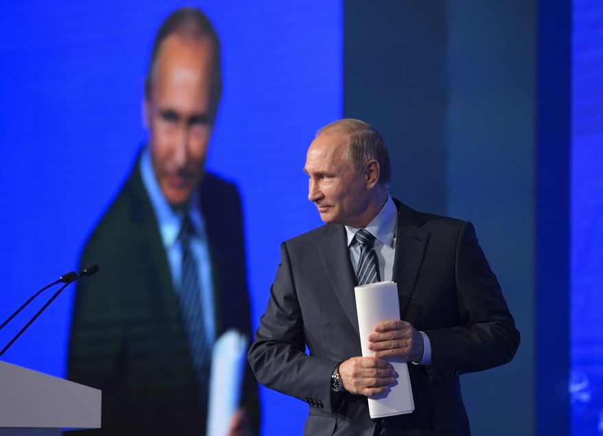 Russian President Vladimir Putin walks to address a forum in Moscow, Russia on Wednesday, Nov. 30, 2016. Putin attended an international forum dedicated to former Prime Minister Yevgeny Primakov. (Alexei Druzhinin/Sputnik, Kremlin Pool Photo via AP)