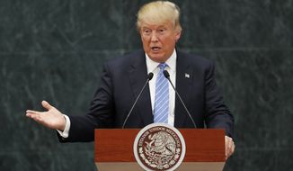 FILE - In this Wednesday, Aug. 31, 2016, file photo, Republican presidential candidate Donald Trump speaks during a joint statement with Mexico&#39;s President Enrique Pena Nieto in Mexico City. American consumers and businesses would pay, literally, if President-elect Trump follows through on his campaign pledge to slap big taxes on imports from China and Mexico. (AP Photo/Dario Lopez-Mills, File)