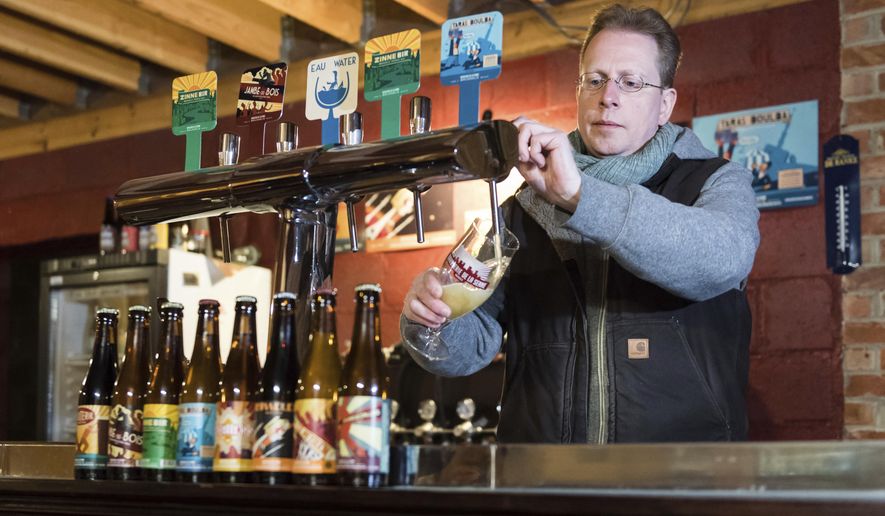 Yvan De Baerts, owner of "Brasserie de la Senne", pours a beer at his brewery in Brussels on Wednesday, Nov. 30, 2016. Belgium is known throughout the world for its wide array of tastes, from extreme sour to bitter, produced in just about every city and village across the west European nation of 11 million people. UNESCO is adding Belgian beer to the list of the "Intangible Cultural Heritage of Humanity". (AP Photo/Geert Vanden Wijngaert)