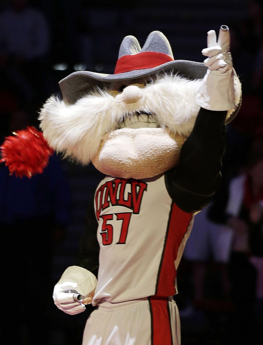 FILE - In this Feb. 1, 2014, file photo, UNLV mascot Hey Reb! warms up the crowd before an NCAA college basketball game in Las Vegas. The student newspaper at the University of Nevada, Las Vegas, is changing its name from "Rebel Yell" to "The Scarlet & Gray Free Press" in a bid to end criticism that it evokes the Civil War Confederacy, officials said. The move comes after several months of debate and a year after a campus diversity office report commissioned by university President Len Jessup concluded that neither the campus "Rebels" nickname nor its "Hey Reb!" mascot have ties to the Confederacy. (AP Photo/Isaac Brekken, File)