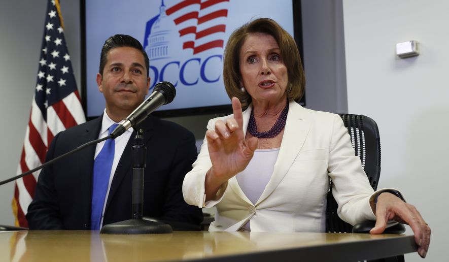 House Minority Leader Nancy Pelosi of Calif., joined by Democratic Congressional Campaign Committee Chairman, Rep. Ben Ray Lujan, D-N.M., speaks during an election day news conference at the Democratic Congressional Campaign Committee Headquarters in Washington, In this Nov. 8, 2016, file photo. (AP Photo/Carolyn Kaster)