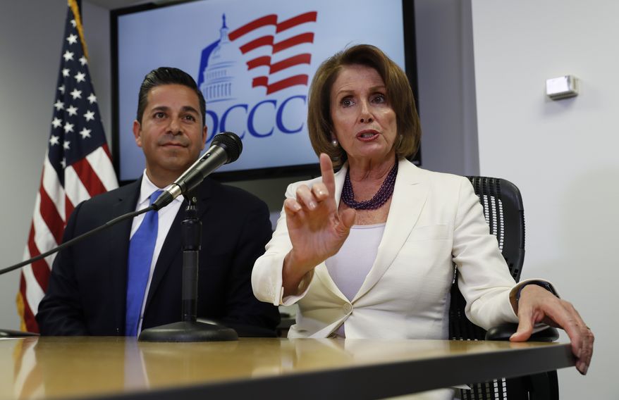 House Minority Leader Nancy Pelosi of Calif., joined by Democratic Congressional Campaign Committee Chairman, Rep. Ben Ray Lujan, D-N.M., speaks during an election day news conference at the Democratic Congressional Campaign Committee Headquarters in Washington, In this Nov. 8, 2016, file photo. (AP Photo/Carolyn Kaster)