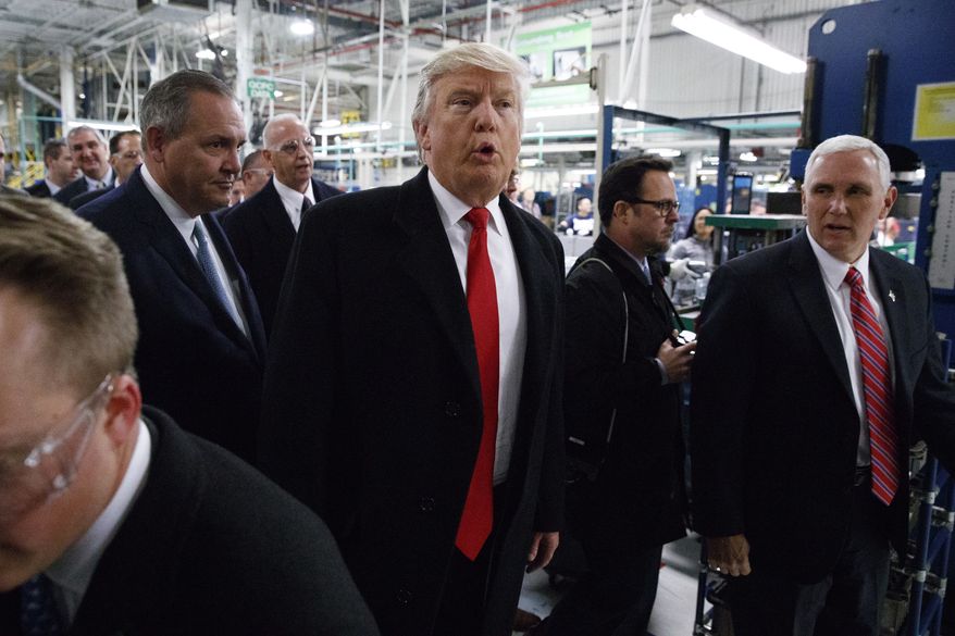 President-elect Donald Trump and Vice President-elect Mike Pence visit the Carrier factory, Thursday, Dec. 1, 2016, in Indianapolis, Ind. (AP Photo/Evan Vucci)