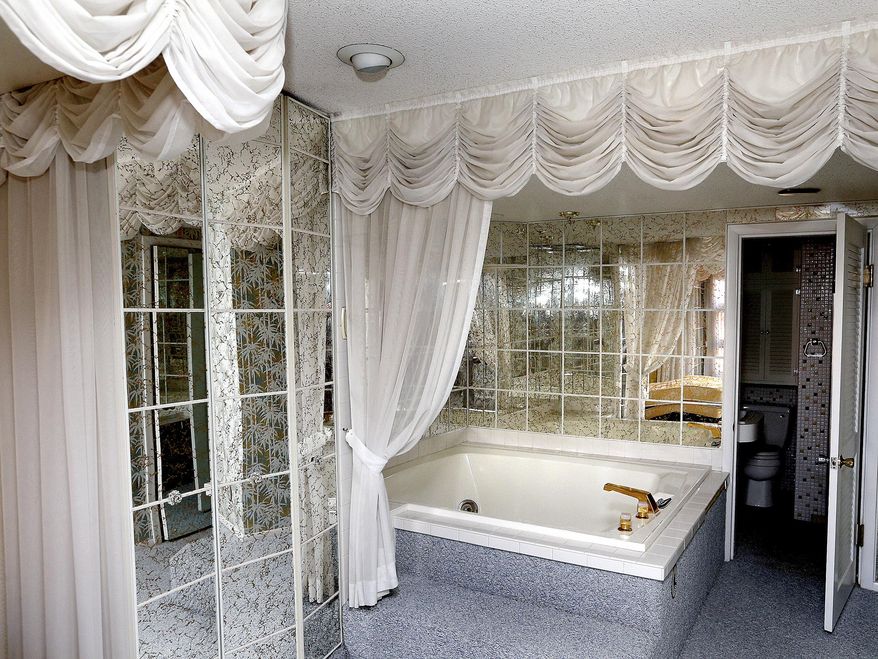 This 2016 photo shows a bathroom in the Pink Palace in La Crosse, Wis. Part of the building will soon house the Three Rivers Scholars House for single mothers and their children. (Peter Thomson/La Crosse Tribune via AP)