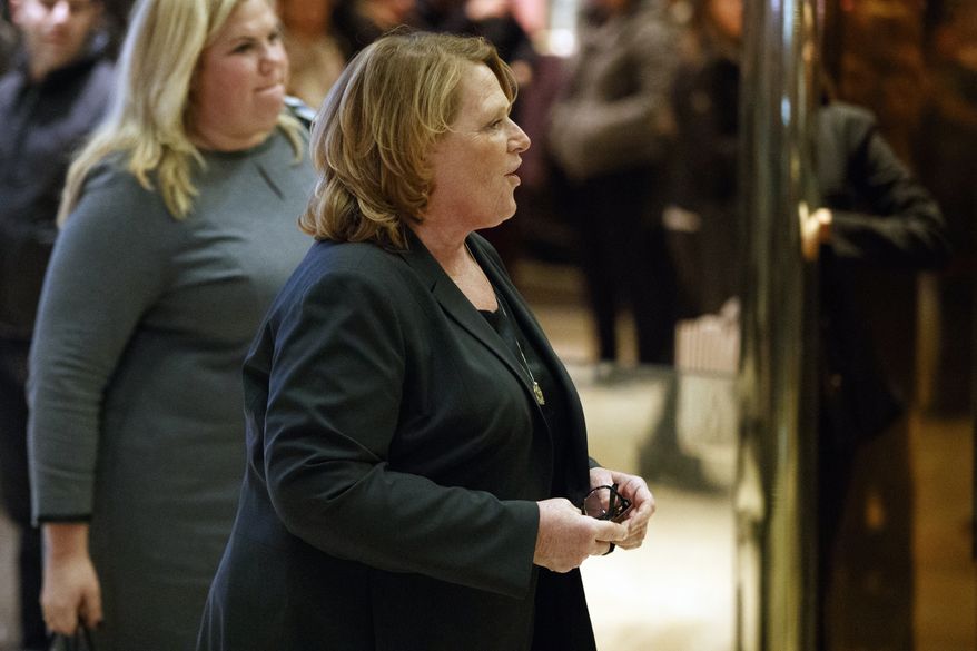 Sen. Heidi Heitkamp, D-N.D., arrives for a meeting with President-elect Donald Trump at Trump Tower, Friday, Dec. 2, 2016, in New York. (AP Photo/Evan Vucci)