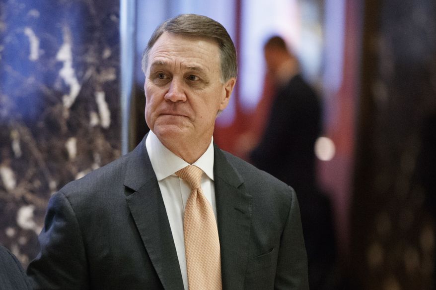 Sen. David Perdue, R-Ga., walks to the elevator for a meeting with President-elect Donald Trump at Trump Tower, Friday, Dec. 2, 2016, in New York. (AP Photo/Evan Vucci) ** FILE **