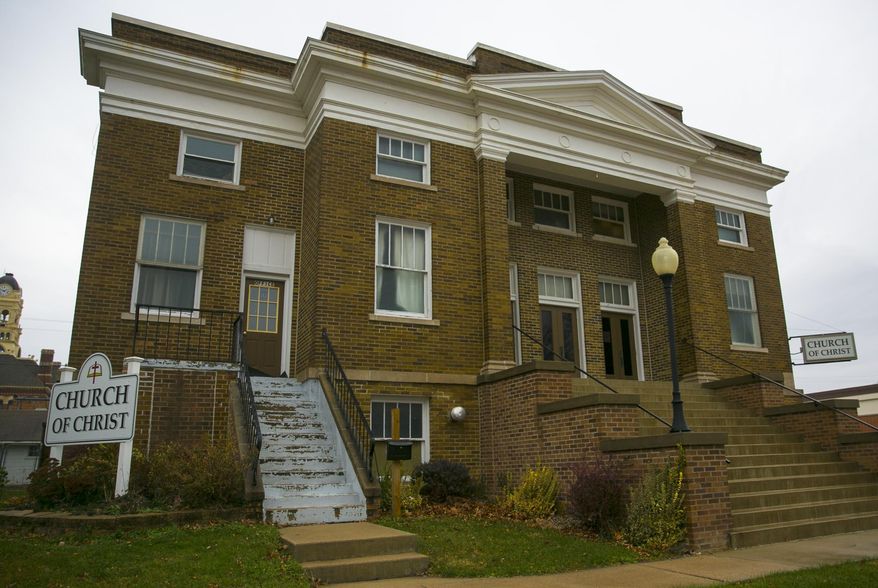 ADVANCE FOR USE SATURDAY, DEC. 3, 2016, AND THEREAFTER- This Nov. 22, 2016, photo shows the congregation of the 100-year-old Church of Christ in Hampton, Iowa., that has moved to a new location while it is decided what to do with the building, as it requires significant upgrades to be considered safe. (Chris Zoeller/Globe-Gazette via AP)