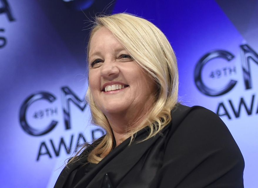 FILE - In this Nov. 4, 2015 file photo, Liz Rose, one of three winners of the award for song of the year for "Girl Crush," poses in the press room at the 49th annual CMA Awards in Nashville, Tenn. Rose penned the inspirational song, "Watch Me Shine," an original song featuring backup vocals from actual Girl Scouts. The track is being used in a Girl Scouts PSA called “I’m Prepared,” which praises girls for being leaders, risk-takers, problem solvers and innovators. (Photo by Evan Agostini/Invision/AP, File)