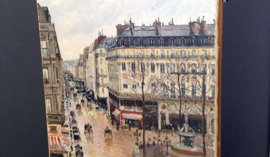 This Sept. 22, 2014 photo made available by Professor Jonathan Petropolous shows Camille Pissarro's 1897 Impressionist masterpiece, "Rue Saint-Honoré, dans l'après-midi. Effet de pluie," during an examination at the Museo Thyssen-Bornemisza in Madrid. In the 16-year battle over this priceless painting looted by the Nazis, there is one point on which all sides agree: When Lilly Cassirer and her husband fled Germany ahead of the Holocaust in 1939, the Jewish couple had to surrender their masterpiece in exchange for their lives. What they disagree on is who owns the painting now. Are the owners the descendants of Cassirer or the Spanish museum that acquired the painting decades ago in good faith. On Monday, Dec. 5, 2016, the case will be argued in a federal appeals court. (Jonathan Petropolous via AP)