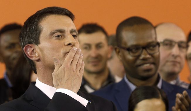 French Prime Minister Manuel Valls blows a kiss to the audience after announcing his candidacy for the Socialist primary next month, in Evry, outside Paris, Monday Dec. 5, 2016. Valls hopes to unite the Socialists under his banner and give the left a chance to stay at the Elysee, in the most ambitious challenge of his political life after president Francois Hollande decided not to run for re-election next year. (AP Photo/Thibault Camus)
