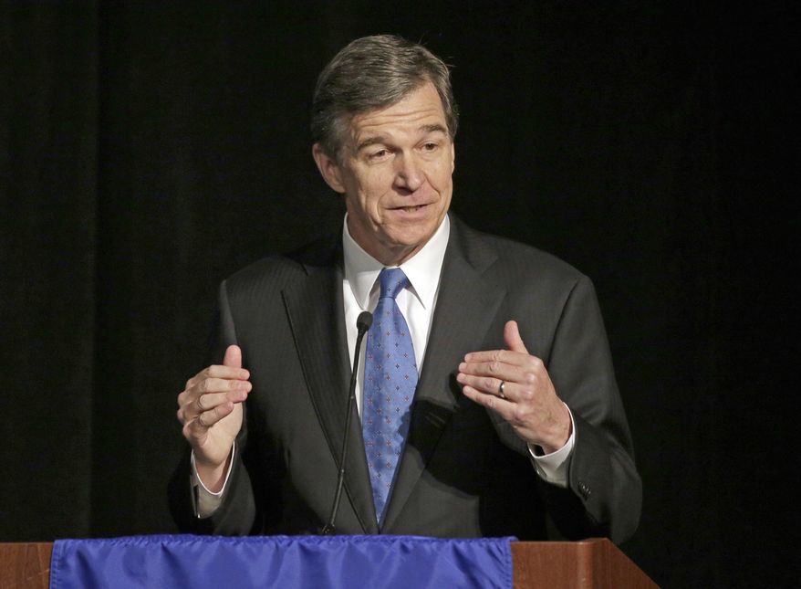 FILE- In this June 24, 2016, file photo, North Carolina Attorney General Roy Cooper speaks during a forum in Charlotte, N.C. North Carolina Gov. Pat McCrory conceded the governor&#39;s race Monday, Dec. 5, 2016, clearing the way for Democrat Cooper to be declared the winner nearly four weeks after Election Day. (AP Photo/Chuck Burton, File)