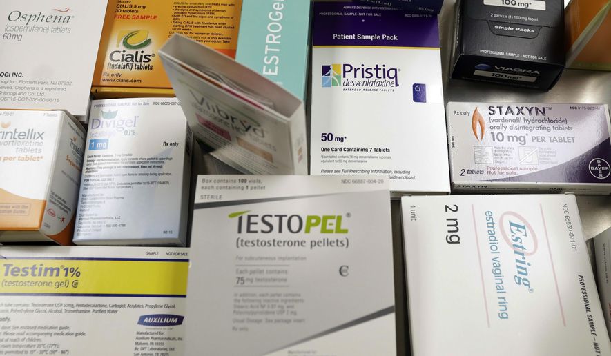 This Tuesday, Nov. 29, 2016 photo shows a display of prescription medicines for impotence and sexual problems at a doctor's office in San Diego. For many couples, doctors say soaring prices for the prescriptions have made sex unaffordable. (AP Photo/Gregory Bull)