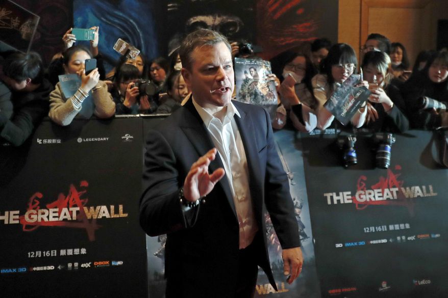 Actor Matt Damon gestures in front of Chinese fans as he arrives at a red carpet event for the movie "The Great Wall" at a hotel in Beijing, Tuesday, Dec. 6, 2016. Damon said Tuesday that his role in the new China-Hollywood production "The Great Wall" was always intended to be European, responding to criticism that an Asian actor should have been picked for the part. (AP Photo/Andy Wong)