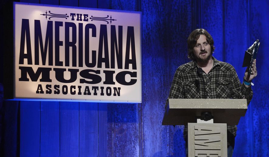 FILE- In this Sept. 17, 2014, file photo, Sturgill Simpson accepts the Emerging Artist of the Year Award during the Americana Music Honors and Awards show in Nashville, Tenn. Simpson's album, "A Sailor's Guide to Earth," was the surprise underdog nomination for the all-genre album of the year category on Tuesday, Dec. 6, 2016, when Grammy nominations were announced. (AP Photo/Mark Zaleski, File)