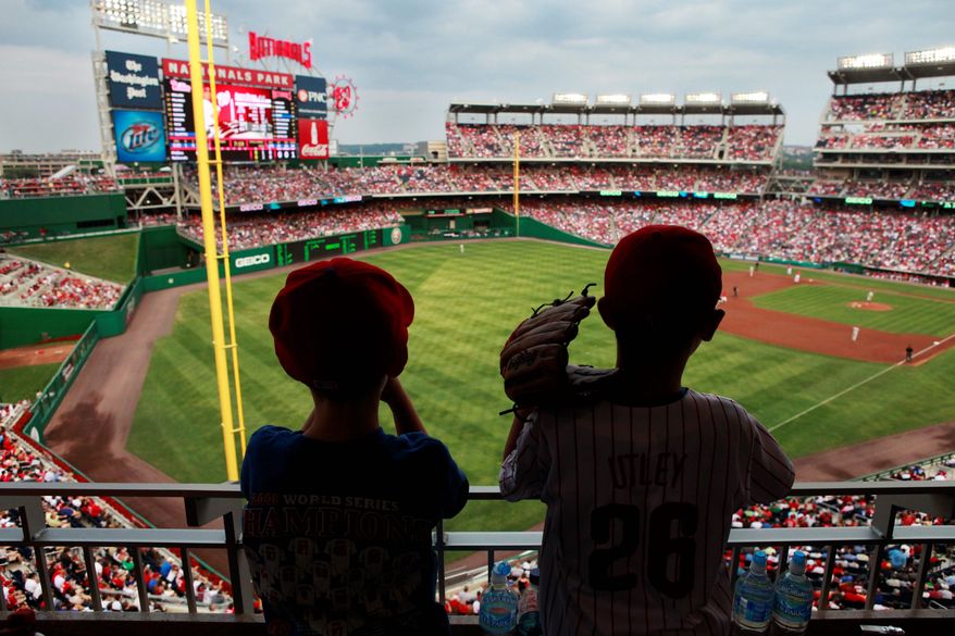 Southwest waterfront residents fear their neighborhood could see their community become polluted after the D.C. Council on Tuesday passed a measure that allows massive LED billboards to be installed on Nationals Park's exterior walls. (Associated Press)