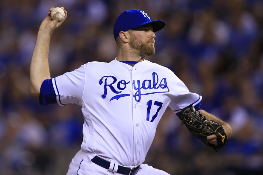 FILE - In this Sept. 17, 2016, file photo, Kansas City Royals relief pitcher Wade Davis throws during a baseball game against the Chicago White Sox, at Kauffman Stadium in Kansas City, Mo. The World Series champion Chicago Cubs have acquired star closer Wade Davis from the Kansas City Royals for outfielder Jorge Soler. The trade was announced Wednesday, Dec. 7, 2016, at the winter meetings. (AP Photo/Orlin Wagner, File)