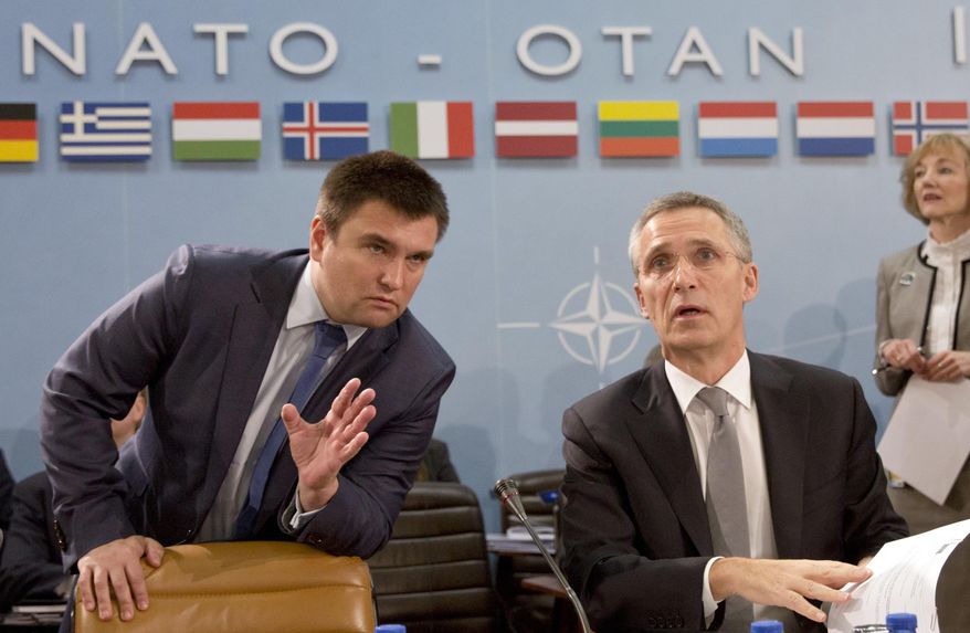 Ukrainian Foreign Minister Pavlo Klimkin, left, speaks with NATO Secretary General Jens Stoltenberg during a round table meeting of the NATO-Ukraine Commission at foreign ministers level at NATO headquarters in Brussels on Wednesday, Dec. 7, 2016. (AP Photo/Virginia Mayo)