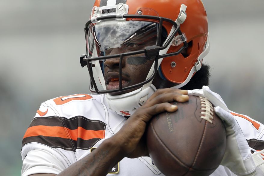 FILE - In this Sept. 11, 2016, file photo, Cleveland Browns' Robert Griffin III warms up before an NFL football game against the Philadelphia Eagles, in Philadelphia. Griffin III is back behind center for the Browns. Griffin will make his second start this season on Sunday, Dec. 11, against Cincinnati. He hasn’t played since the Sept. 11 opener when he broke a bone in his left shoulder late in the fourth quarter against Philadelphia. (AP Photo/Matt Rourke, File) **FILE**