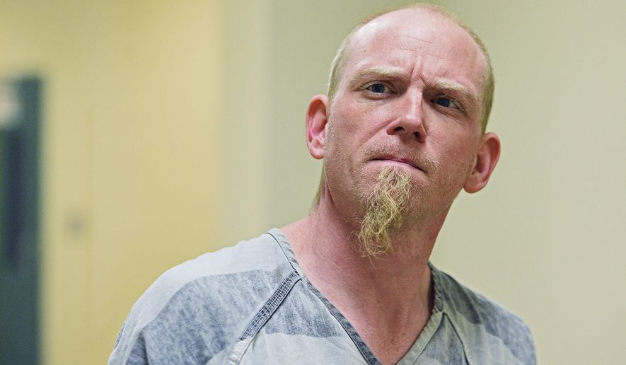 Keith Cornett is escorted into Minnehaha County Court Thursday, Dec. 8, 2016, in Sioux Falls, S.D. Sheriff's officials say Cornett, the stepfather of an 18-month-old boy, has been arrested and charged in the child's death in southeastern South Dakota. (Joe Ahlquist /The Argus Leader via AP)