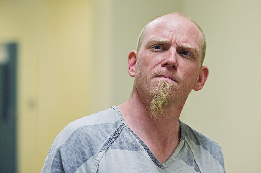 Keith Cornett is escorted into Minnehaha County Court Thursday, Dec. 8, 2016, in Sioux Falls, S.D. Sheriff's officials say Cornett, the stepfather of an 18-month-old boy, has been arrested and charged in the child's death in southeastern South Dakota. (Joe Ahlquist /The Argus Leader via AP)
