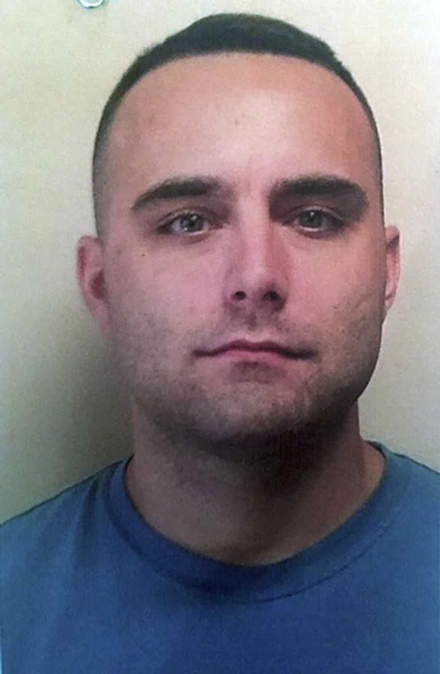 CORRECTS FIRST NAME TO JODY FROM JODI - In this undated photo released by the Americus Police Department, Americus Police Officer Nicholas Smarr poses for a photo, in Americus, Ga. Police Chief Mark Scott said officer Smarr died and Georgia Southwestern State University Officer Jody Smith was airlifted to a hospital in critical condition after the officers were shot while responding to a report of a domestic dispute at an apartment complex near the campus Wednesday morning, Dec. 7, 2016. (Americus Police Department via AP)