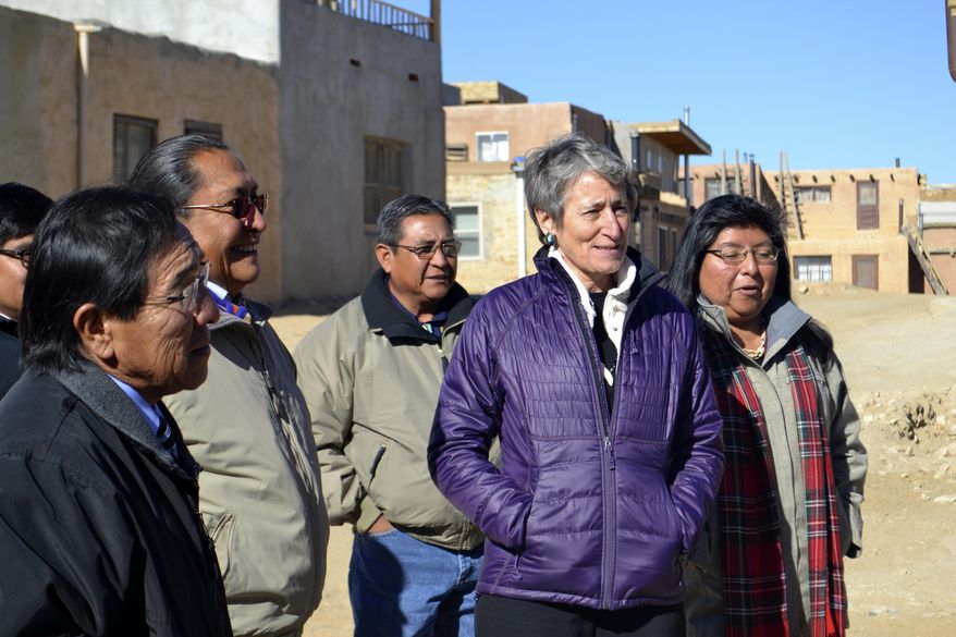 U.S. Interior Secretary Sally Jewell, second from right, tours Acoma Pueblo, a nearly thousand-year-old village that's situated atop a New Mexico mesa, with tribal leaders on Thursday, Dec. 8, 2016. Jewell says the visit to Acoma Pueblo is expected to be her last to a reservation as secretary of the Interior, which oversees the Bureau of Indian Affairs. (AP Photo/Mary Hudetz)