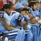 FILE - In this Oct. 27, 2016, file photo, Tennessee Titans running back Derrick Henry, left, sits next to wide receiver Tajae Sharpe (19) on the sideline in the first half of an NFL football game against the Jacksonville Jaguars, in Nashville, Tenn. A year after winning the Heisman Trophy, rookie running back Derrick Henry is practicing patience playing with the Tennessee Titans where he is backing up the NFL&#39;s second-best rusher in DeMarco Murray. (AP Photo/Weston Kenney, File)